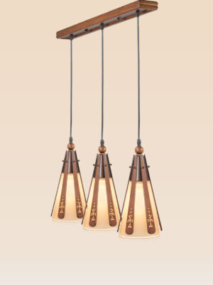 Triple pendant light with floral-carved wood slats and frosted glass cones suspended from a long wooden rectangular base – Checkmark Model 22h3 – perfect for dining tables or kitchen islands