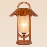Lantern-style wooden table lamp with floral carvings – Checkmark