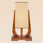 Modern wooden table lamp with tall rectangular woven shade and curved supports – Checkmark