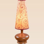 Handcrafted wooden table lamp with red swirl patterned shade and rounded base – Model 512