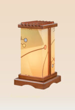 Modern wooden table lamp with geometric-patterned acrylic panels and soft amber glow, handcrafted by DARKAR