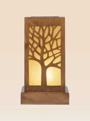 Wooden table lamp with intricate tree silhouette and warm light – handcrafted by DARKAR, available at Checkmark Trading Dubai-front view