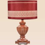 Handcrafted wooden table lamp with carved brown base and deep red patterned fabric shade – DARKAR design from Checkmark Trading Dubai