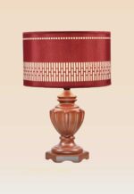 Handcrafted wooden table lamp with carved brown base and deep red patterned fabric shade – DARKAR design from Checkmark Trading Dubai
