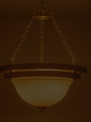 Elegant ceiling pendant light with frosted glass dome shade and bronze chain suspension, perfect for classic and transitional interiors