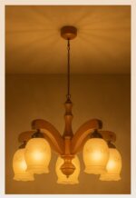 Five-light wooden chandelier with arched arms and floral frosted glass shades, suspended by a chain from a wood canopy – Model 208-5-light-on