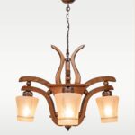 Wooden chandelier 210-3 with three frosted floral glass shades and rustic curved arms, crafted by DARKAR Lighting Industries.