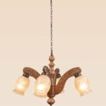 Traditional wooden chandelier 234-4 with carved arms and frosted floral glass shades, vintage rustic chandelier by DARKAR Lighting Industries.