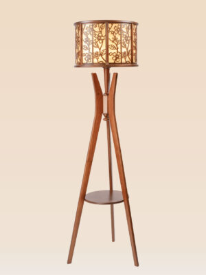 Wooden tripod floor lamp model 635 with glowing floral-pattern drum shade and mid-level round shelf – artistic decorative lighting for living or bedroom use