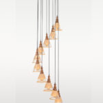 Ten-light cascading pendant lamp with frosted etched glass and wooden caps – Checkmark Model 38-10 – ideal for staircases, lobbies, and high ceilings
