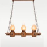 Triple glass oil-lamp style pendant light with wooden beam and chain suspension – Checkmark Model 40h3 – perfect for rustic kitchens, lodges, and heritage interiors