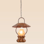 Wooden lantern-style pendant light with floral frosted glass and arched metal arms – Checkmark Model 48 – ideal for rustic interiors and romantic cottage lighting