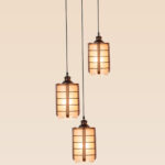 Triple pendant light with wooden grid frames and frosted cylindrical glass – Checkmark Model 27-3 – ideal for stairwells, foyers, and dining areas