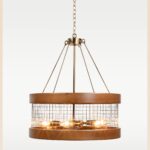 Industrial chandelier with golden bulb holders, black mesh, and round wooden frame – Checkmark Model 59g – rustic modern pendant chandelier with warm glow
