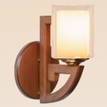 Rustic wooden wall sconce light with amber frosted square glass shade – distributed by Checkmark, crafted by DARKAR Lighting Industries