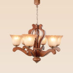 Traditional wooden chandelier model 244a6 with six sculpted arms, flared frosted glass shades, and bronze fittings — a handcrafted wooden ceiling light by Checkmark
