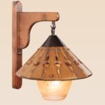 Rustic wooden wall sconce light with hanging conical wooden shade and frosted etched glass – distributed by Checkmark, crafted by DARKAR Lighting Industries.