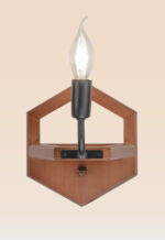 Wooden wall sconce light with hexagonal backplate and exposed candle-style bulb – distributed by Checkmark, crafted by DARKAR Lighting Industries.