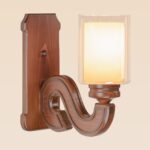 Wooden wall sconce light with modern glass cylinder shade – distributed by Checkmark, crafted by DARKAR Lighting Industries.