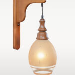 Wooden wall sconce light with round frosted glass shade – distributed by Checkmark, crafted by DARKAR Lighting Industries.