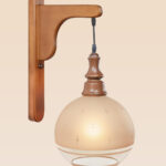 Wooden wall sconce light with star-etched frosted glass globe shade – distributed by Checkmark, crafted by DARKAR Lighting Industries.