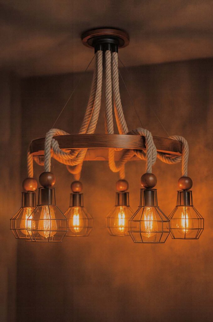 Lighting temperature for wooden fixtures demonstrated on a wooden chandelier with warm LED bulbs