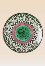 Handmade ceramic decorative plate featuring green glaze and artisan patterns
