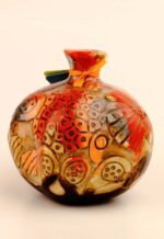 Carved ceramic pomegranate décor with relief surface detail and layered glaze