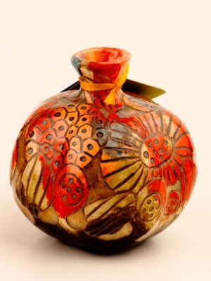 Carved relief ceramic pomegranate art object for elegant interior decoration