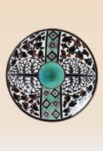 Handcrafted ceramic decorative dish with traditional black and green motifs