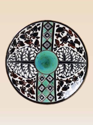 Handcrafted ceramic decorative dish with traditional black and green motifs