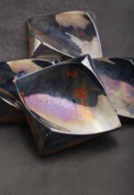 Handcrafted ceramic decorative square tile in celadon green with sculpted surface and lustre glaze