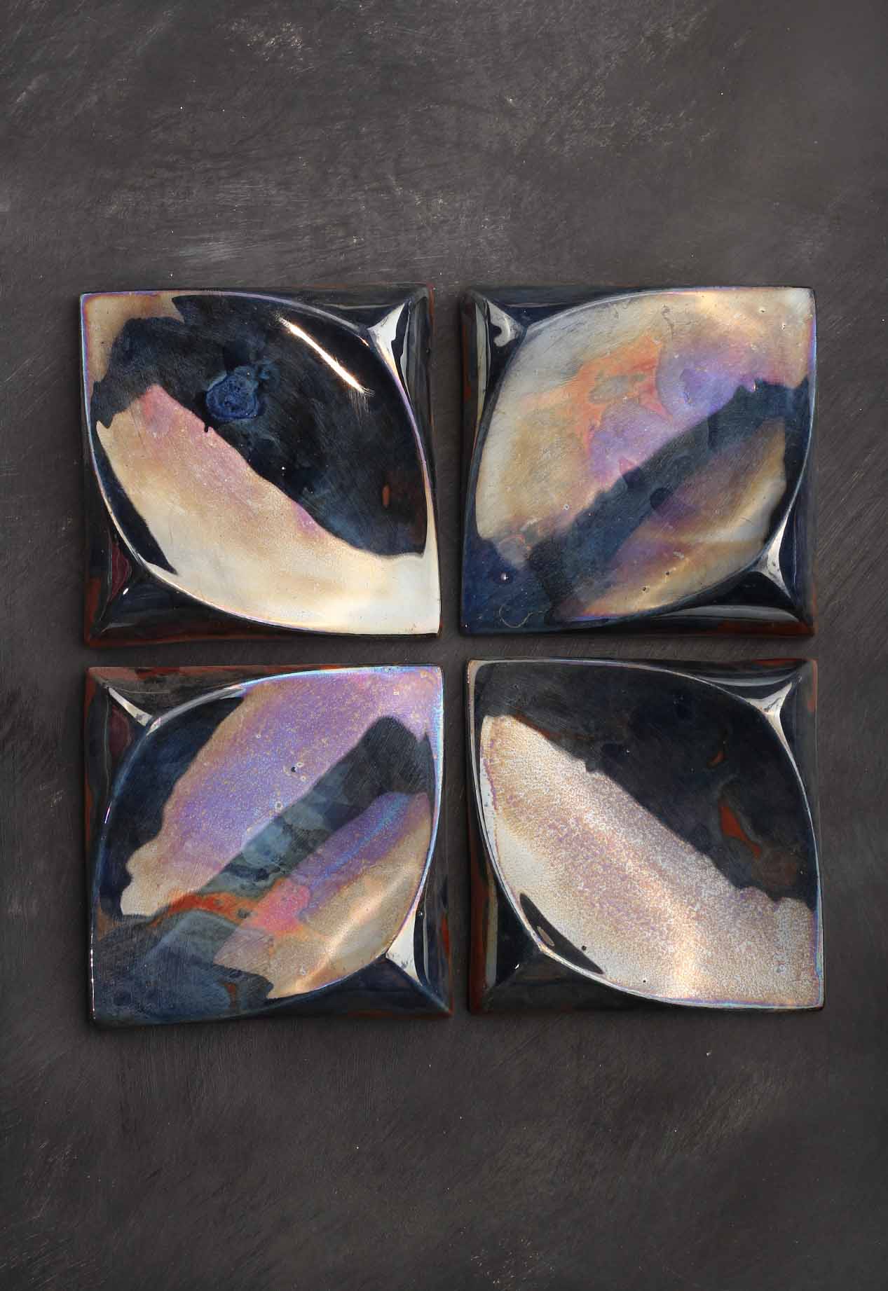flux-square-tile-handcrafted-ceramic-decorative-hero Flux Square Tile, a handcrafted ceramic decorative square tile with sculpted curvature and lustre glaze