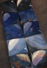 Multiple Flux Square Tiles showing handcrafted ceramic decorative square tile forms with tonal variation