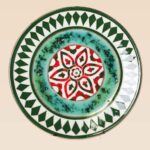 decorative ceramic dish star pattern with green and red radial design