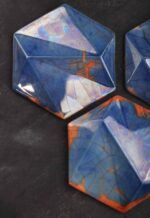 Handcrafted ceramic hex tile in cobalt blue with amber accents, offering rich color depth for architectural and interior design item 1