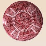 Handcrafted ceramic decorative dish suitable for wall or tabletop display in red