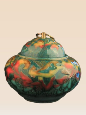 Patina glaze ceramic lidded jar with layered color tones and sculptural form