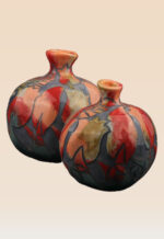 Abstract pomegranate ceramic art featuring hand-finished surface details
