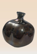 Close-up of pomegranate ceramic art gloss showing reflective glaze