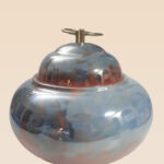 Refined glaze ceramic lidded jar with smooth surface and sculptural form