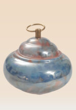 Detail of refined glaze ceramic lidded jar showing lid and balanced silhouette