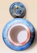 Refined glaze ceramic lidded jar with smooth surface and sculptural form opened lid