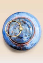 Refined glaze ceramic lidded jar with smooth surface and sculptural form top view
