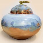 Refined glaze ceramic lidded jar with smooth surface and sculptural form