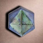 Prism hex tile with glossy glaze and faceted geometric surface