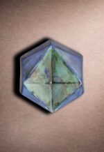 Prism hex tile with glossy glaze and faceted geometric surface