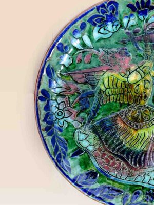 decorative ceramic dish blue green pattern design patina style close up