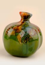 Patina ceramic pomegranate showing soft glaze detail and organic surface pattern