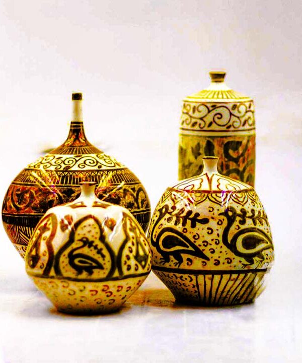 Ceramic decor material pairing with wood, stone, glass, metal and warm lighting in jars